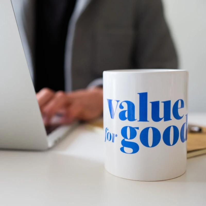 A ceramic mug featuring the phrase "Value for Good," symbolizing positivity and social responsibility.